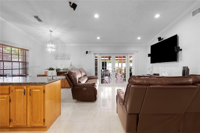 19251 SW 118th Ct, Miami, FL 33177 - living area with crown molding, a chandelier, healthy amount of natural light, lofted ceiling, and light tile patterned floors