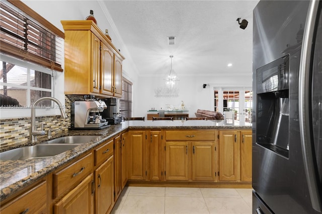 19251 SW 118th Ct, Miami, FL 33177 - kitchen with stainless steel fridge, a sink, crown molding, backsplash, and a peninsula
