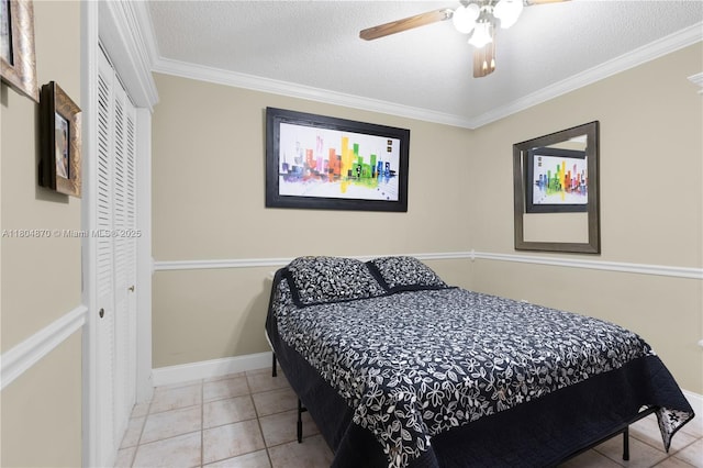 19251 SW 118th Ct, Miami, FL 33177 - bedroom featuring a closet, ornamental molding, tile patterned floors, a textured ceiling, and ceiling fan