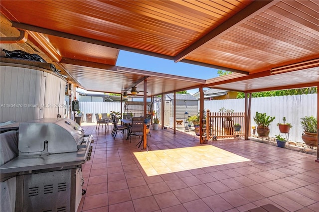 19251 SW 118th Ct, Miami, FL 33177 - view of patio / terrace featuring outdoor dining area, an outdoor structure, a storage unit, a fenced backyard, and a grill