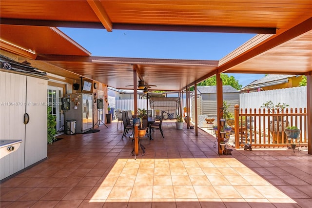 19251 SW 118th Ct, Miami, FL 33177 - view of patio with outdoor dining area, a storage unit, a ceiling fan, an outdoor structure, and a fenced backyard