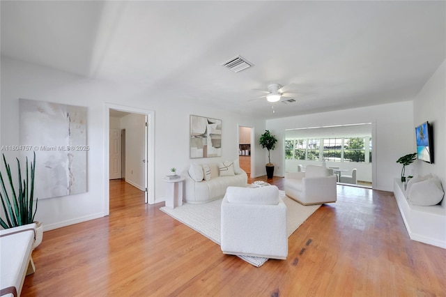 13521 S Biscayne River Rd, Miami, FL 33161 - living room with ceiling fan, light wood-style floors, and baseboards