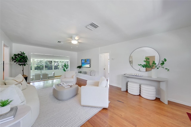 13521 S Biscayne River Rd, Miami, FL 33161 - living area featuring light wood-style flooring, ceiling fan, and baseboards