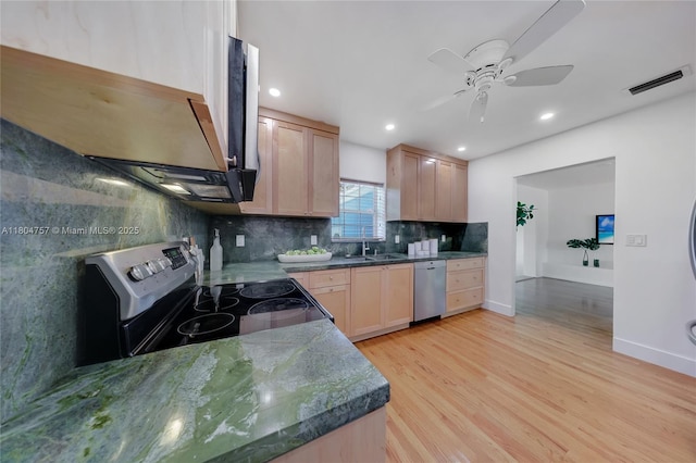 13521 S Biscayne River Rd, Miami, FL 33161 - kitchen with appliances with stainless steel finishes, light brown cabinets, tasteful backsplash, light wood finished floors, and a ceiling fan