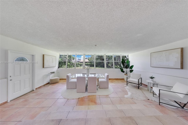 13521 S Biscayne River Rd, Miami, FL 33161 - dining room with a textured ceiling, light tile patterned floors, and baseboards
