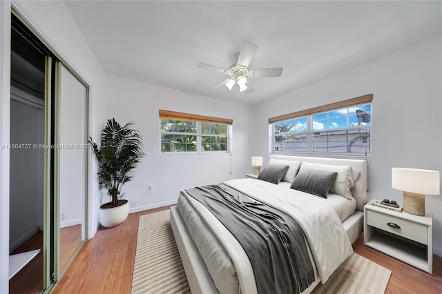 13521 S Biscayne River Rd, Miami, FL 33161 - bedroom with wood finished floors, baseboards, a closet, and a ceiling fan