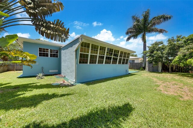 13521 S Biscayne River Rd, Miami, FL 33161 - rear view of property featuring stucco siding and an outdoor structure