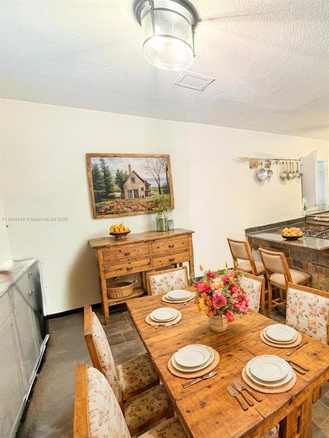 625 NE 130th St, North Miami, FL 33161 - dining space with a textured ceiling