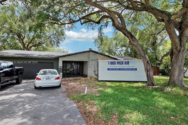 7505 SW 167th St, Palmetto Bay, FL 33157 - view of front of home featuring concrete driveway and an attached garage