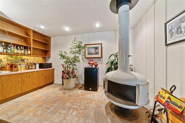 7505 SW 167th St, Palmetto Bay, FL 33157 - indoor bar featuring a wood stove, recessed lighting, and brick patterned floors