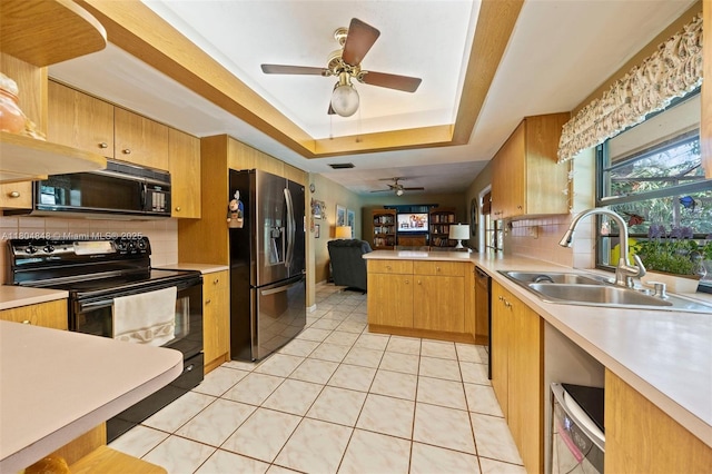 7505 SW 167th St, Palmetto Bay, FL 33157 - kitchen with black appliances, a sink, a ceiling fan, tasteful backsplash, and a peninsula