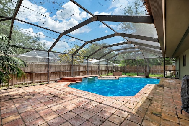 7505 SW 167th St, Palmetto Bay, FL 33157 - view of swimming pool featuring a fenced backyard, a patio, a lanai, and a jacuzzi