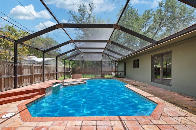 7505 SW 167th St, Palmetto Bay, FL 33157 - view of pool with a jacuzzi, a fenced backyard, a patio area, and glass enclosure