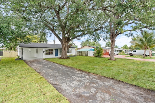 6845 SW 12th St, Pembroke Pines, FL 33023 - ranch-style house featuring driveway and an attached carport