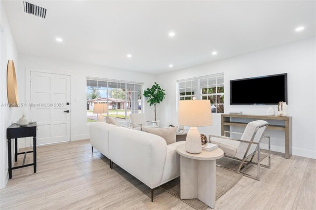 6845 SW 12th St, Pembroke Pines, FL 33023 - living area with light wood-style flooring, recessed lighting, and baseboards