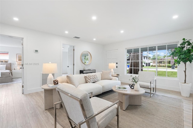 6845 SW 12th St, Pembroke Pines, FL 33023 - living room with light wood-style floors, recessed lighting, healthy amount of natural light, and baseboards