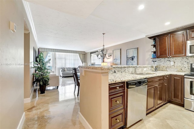 3725 S Ocean Dr Unit 1014, Hollywood, FL 33019 - kitchen featuring stainless steel appliances, crown molding, a sink, a chandelier, and open floor plan