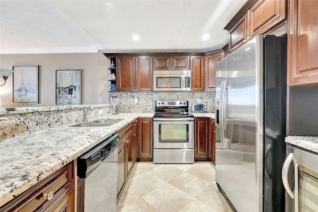 3725 S Ocean Dr Unit 1014, Hollywood, FL 33019 - kitchen featuring stainless steel appliances, a sink, ornamental molding, light stone countertops, and open shelves