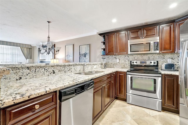 3725 S Ocean Dr Unit 1014, Hollywood, FL 33019 - kitchen with appliances with stainless steel finishes, a chandelier, a sink, crown molding, and tasteful backsplash