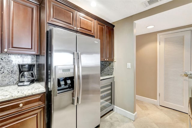 3725 S Ocean Dr Unit 1014, Hollywood, FL 33019 - kitchen featuring stainless steel refrigerator with ice dispenser, wine cooler, backsplash, light stone counters, and recessed lighting