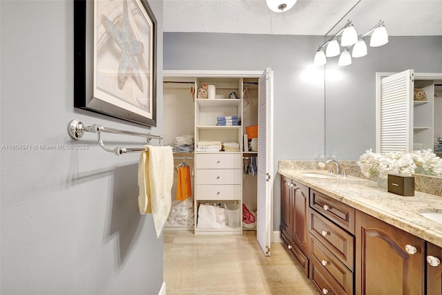 3725 S Ocean Dr Unit 1014, Hollywood, FL 33019 - bathroom with double vanity and a spacious closet