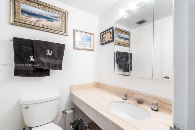 1980 S Ocean Dr Unit 9K, Hallandale Beach, FL 33009 - half bathroom featuring toilet and vanity