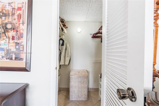 1980 S Ocean Dr Unit 9K, Hallandale Beach, FL 33009 - laundry area with light tile patterned floors and baseboards