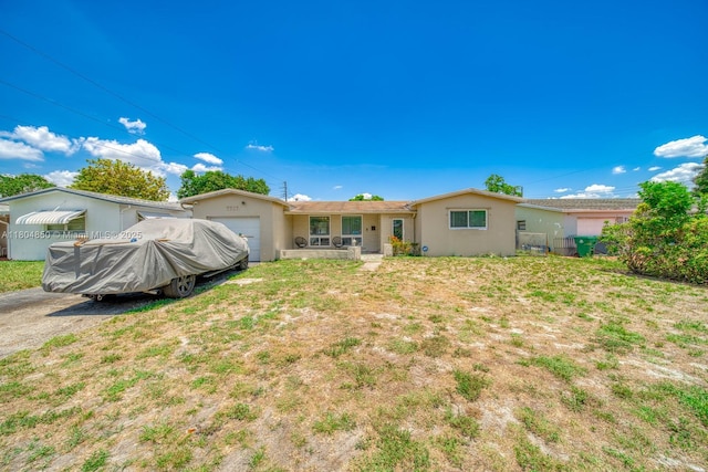 7717 Coral Blvd, Miramar, FL 33023 - back of property featuring stucco siding and an attached garage