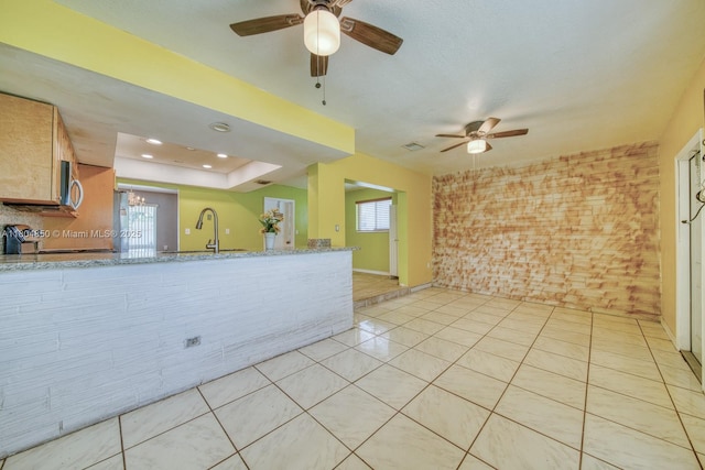 7717 Coral Blvd, Miramar, FL 33023 - kitchen with a sink, brick wall, ceiling fan, and healthy amount of natural light