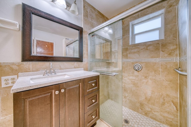 7717 Coral Blvd, Miramar, FL 33023 - bathroom with a shower stall, vanity, and tile walls