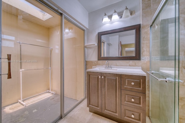 7717 Coral Blvd, Miramar, FL 33023 - full bath with tile walls, vanity, a stall shower, and tile patterned floors