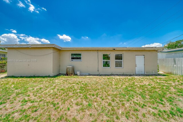 7717 Coral Blvd, Miramar, FL 33023 - rear view of house featuring stucco siding