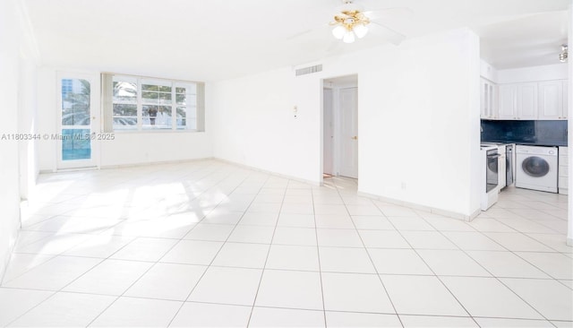 6770 Indian Creek Dr Unit 4P, Miami Beach, FL 33141 - empty room featuring separate washer and dryer, ceiling fan, and baseboards