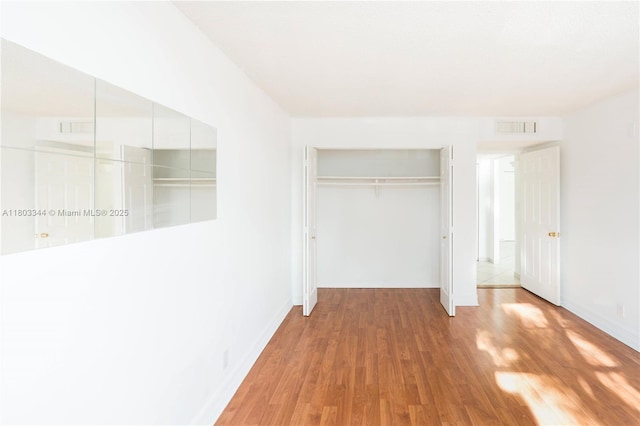 6770 Indian Creek Dr Unit 4P, Miami Beach, FL 33141 - unfurnished bedroom featuring wood finished floors and baseboards