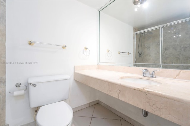 6770 Indian Creek Dr Unit 4P, Miami Beach, FL 33141 - bathroom featuring a sink, tile patterned floors, toilet, and an enclosed shower