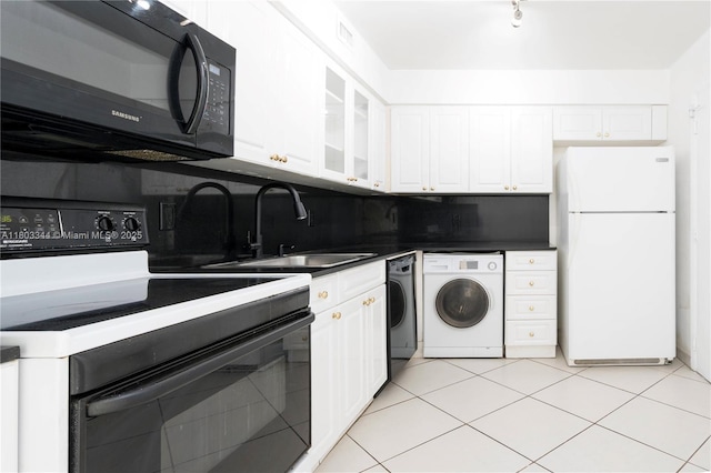 6770 Indian Creek Dr Unit 4P, Miami Beach, FL 33141 - kitchen with freestanding refrigerator, electric range oven, black microwave, and washer / clothes dryer