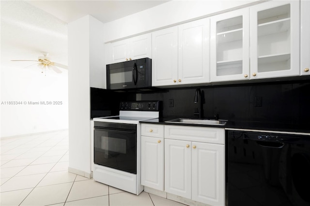 6770 Indian Creek Dr Unit 4P, Miami Beach, FL 33141 - kitchen featuring black appliances, a sink, ceiling fan, and white cabinets