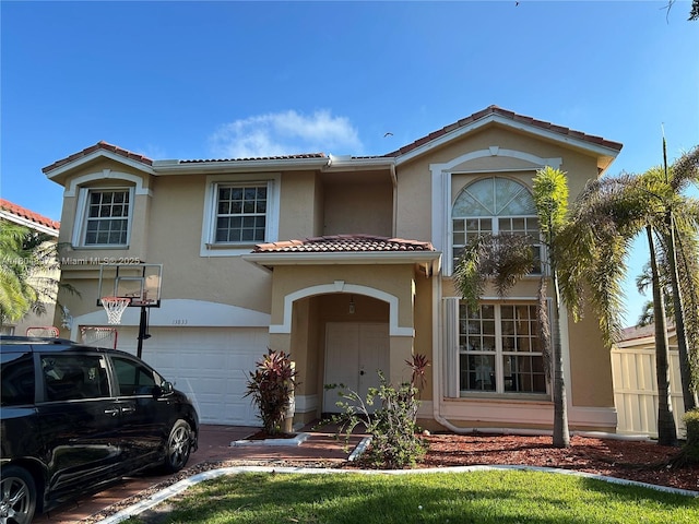 13833 NW 22nd St, Sunrise, FL 33323 - view of front facade featuring stucco siding, a tile roof, and a garage