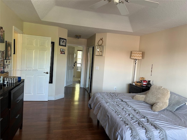 13833 NW 22nd St, Sunrise, FL 33323 - bedroom with dark wood-style floors, a textured ceiling, baseboards, and a ceiling fan