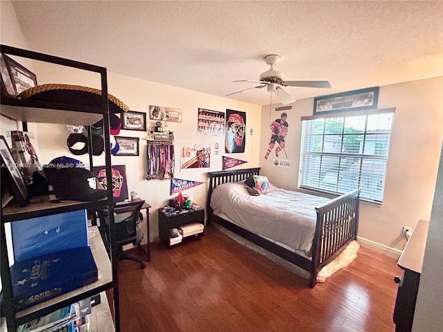 13833 NW 22nd St, Sunrise, FL 33323 - bedroom featuring wood finished floors, a textured ceiling, baseboards, and ceiling fan