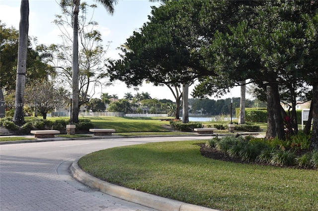 13833 NW 22nd St, Sunrise, FL 33323 - view of home's community featuring a yard and a water view