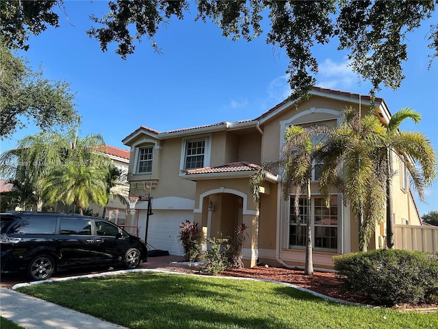 13833 NW 22nd St, Sunrise, FL 33323 - mediterranean / spanish home featuring stucco siding, a tiled roof, an attached garage, and a front lawn