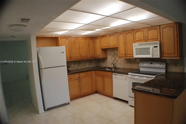 611 N University Dr Unit 3, Plantation, FL 33324 - kitchen featuring white appliances, a sink, dark stone countertops, decorative backsplash, and light tile patterned floors