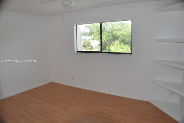 611 N University Dr Unit 3, Plantation, FL 33324 - empty room featuring light wood finished floors, baseboards, and a ceiling fan