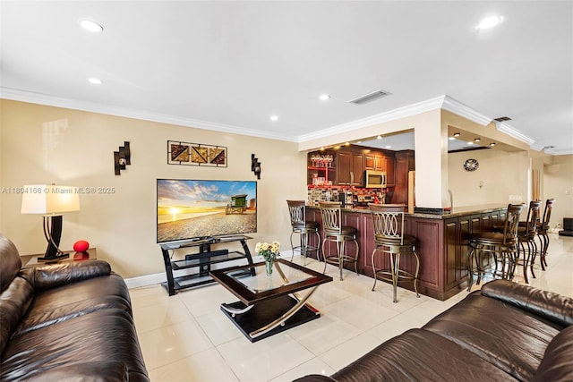 3553 NE 171st St Unit P, North Miami Beach, FL 33160 - living area featuring bar with sink, recessed lighting, crown molding, light tile patterned floors, and baseboards