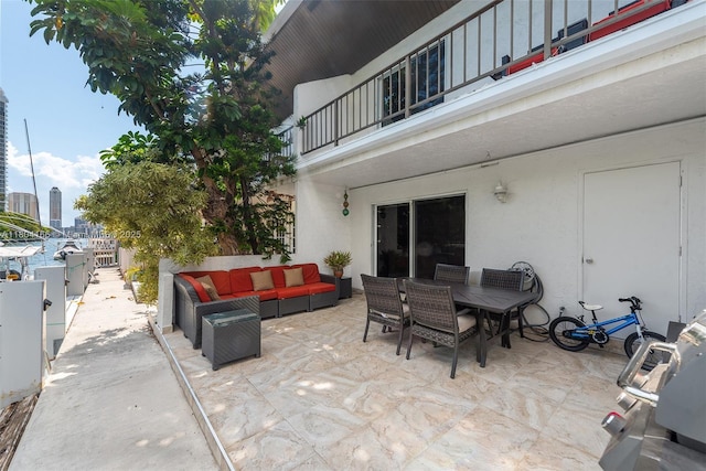 3553 NE 171st St Unit P, North Miami Beach, FL 33160 - view of patio / terrace featuring a balcony, an outdoor living space, and outdoor dining area