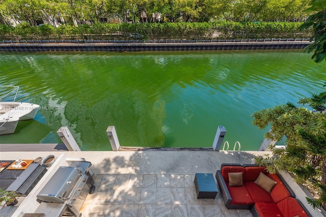 3553 NE 171st St Unit P, North Miami Beach, FL 33160 - dock with a water view and outdoor lounge area