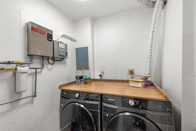3553 NE 171st St Unit P, North Miami Beach, FL 33160 - washroom featuring independent washer and dryer and a textured wall