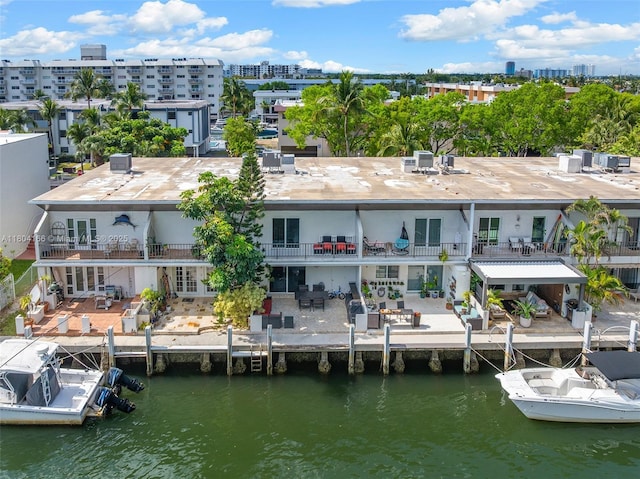 3553 NE 171st St Unit P, North Miami Beach, FL 33160 - rear view of property featuring a patio area and a water view
