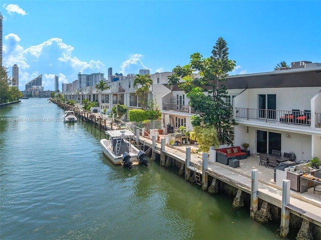 3553 NE 171st St Unit P, North Miami Beach, FL 33160 - dock area featuring an outdoor hangout area, a water view, and a balcony